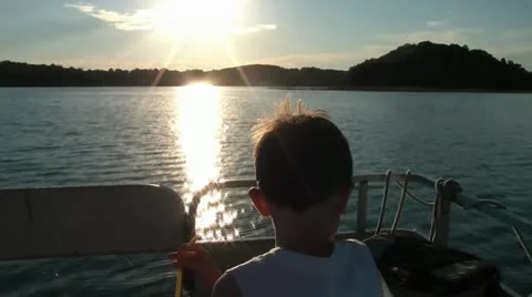 Boys Boat Ride Towards Sunset Video stock 12572053