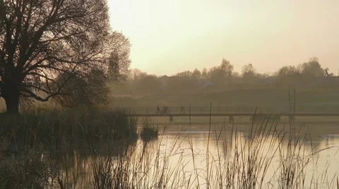 Boys on a bridge at sunset Stock-Footage 68535963