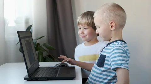 Boys, children working on a computer, programming, learning or playing 스톡 동영상 120666384