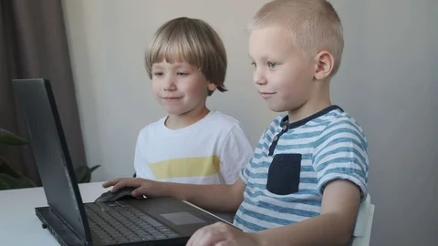 Boys, children working on a computer, programming, learning or playing Stock Footage 120717306