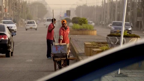 Boys cleaning the road Stock Footage 111702907