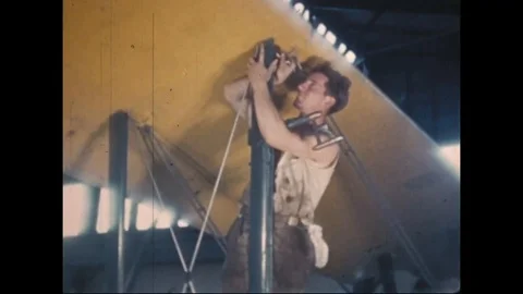Boys conducting riveting and assembling airplane parts - 1940 Stock Footage 110911962