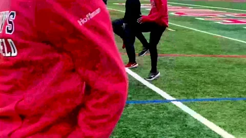 Boys doing track running drills on a turf field 2206 1 Stock Footage 167959697