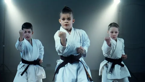 Boys during practice karate. Group of young boys wearing karate uniforms Stock Footage 284707171