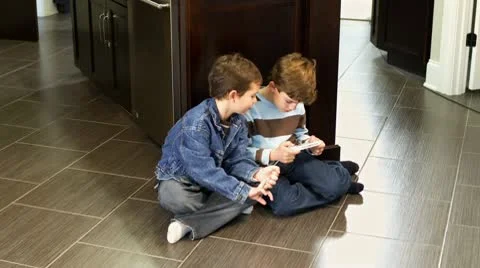 Boys fighting over game Stock Footage 10762363