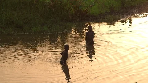 Boys Fish in Water Video stock 74359424
