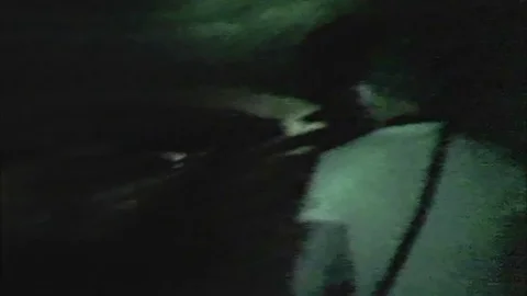 Boys with flashlight explore mysterious building 스톡 동영상 100513362