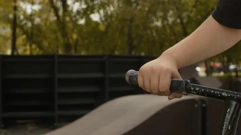 Boys hand on the handlebar Stock Footage 143791135