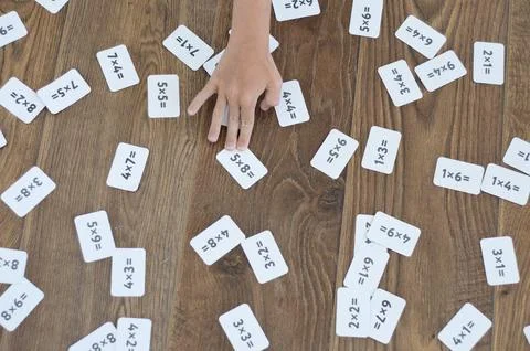 Boys hand picks up the math problems Foto stock
