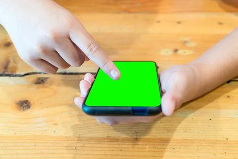 Boy's hand using phone Stock Photos