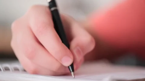 Boys hand write on notepad by pen Stock Footage 267692126