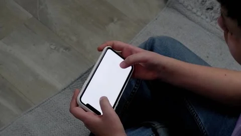 Boy's hands are touching a mobile phone Stock Footage 169458327