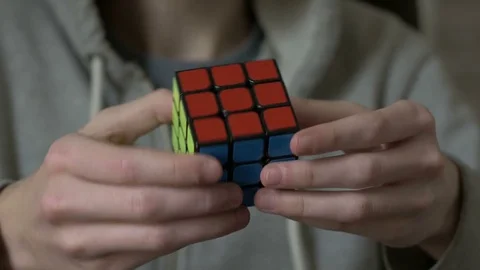 Boys hands solving rubik cube and showing thumb 스톡 동영상 72663766