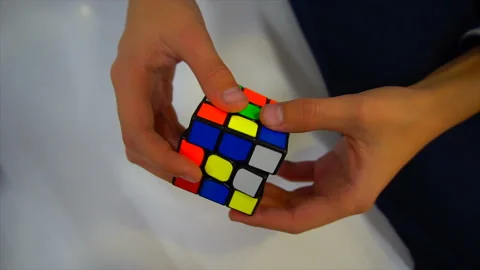 Boys hands solving rubik cube Stock-Footage 97034317