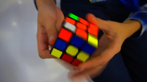 Boys hands solving rubik cube Stock Footage 97034530