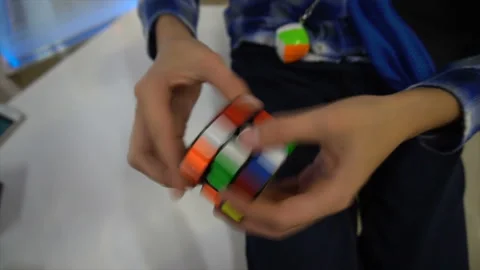 Boys hands solving rubik cube Stock Footage 97034954