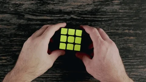Boys hands solving Rubik's Cube. Top view Stock Footage 82902015
