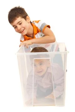 Boys having fun with a box Stock Photos