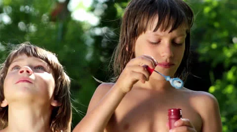 Boys inflates the bubble blower Stock Footage 24964726