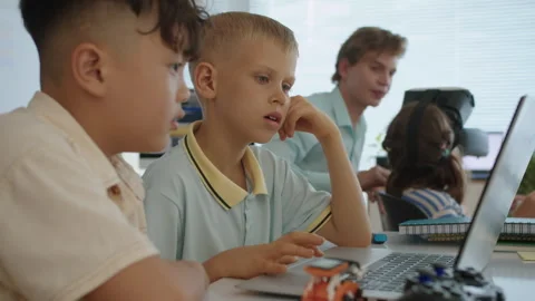 Boys Learning to Write Programming Code on Laptop at IT Class Stock Footage 280536062