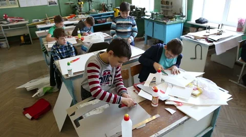 Boys make model airplanes Stock Footage 59112344