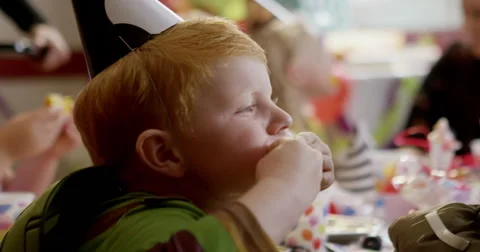 Boys making funny faces during a birthday party Stock Footage 58573901