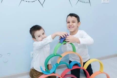 Boys play in different intelectual games in preschool classroom Stock Photos