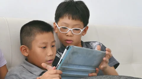 Boys play game on computer Stock Footage 57359499