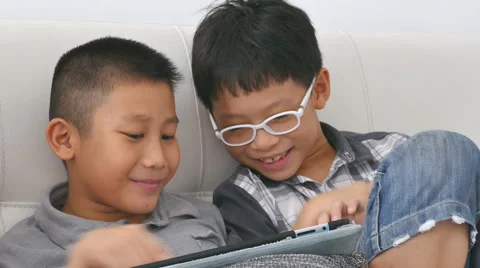 Boys play game on computer Stock Footage 57360017