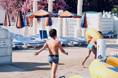 Boys playing on the beach Stock Photos