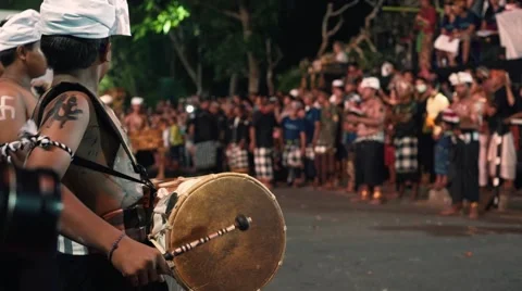 Boys playing drums, man dance and perform on Ogoh-ogoh festival in Sanur Stock Footage 64286378