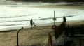 Boys playing football on the beach HD Footage