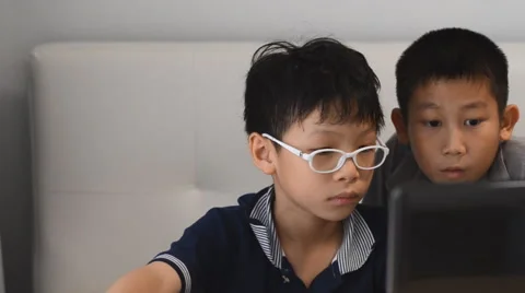 Boys playing game on computer Stock Footage 57334890