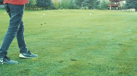 Boys playing a game of golf on course Stock Footage 55015213
