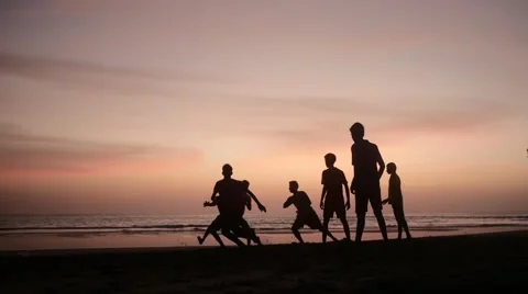 Boys playing games on beach Stock Footage 61139987