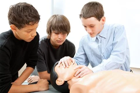 Boys Practicing CPR Stock Photos