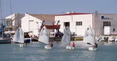 Boys practicing sailing at a sail school in the harbor of Zadar, Croatia Stock Footage 82110687