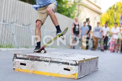 Boys skateboarding on street. Urban life. Stock Photos