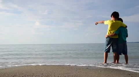 Boys stand on the beach Stock Footage 56958258