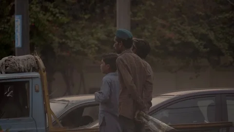 Boys standing at the side of road Stock Footage 111703025