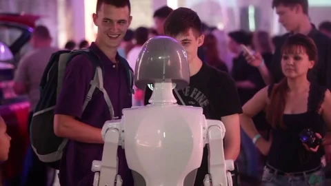 Boys talking with smart promo robot Stock Footage 76363217