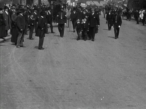 Boys in two lines are marched ahead and directed by men, United Kingdom, 1901 Stock Footage 132021966