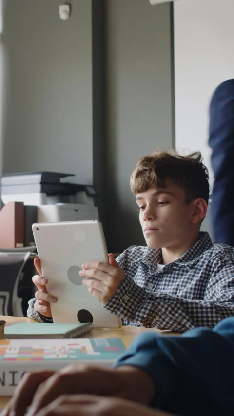 Boys Working on Coding Projects and Male Teacher Checking Video stock 278585175