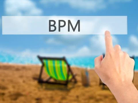 BPM (Business Process Management) - Hand pressing a button on blurred backgro Stock Photos