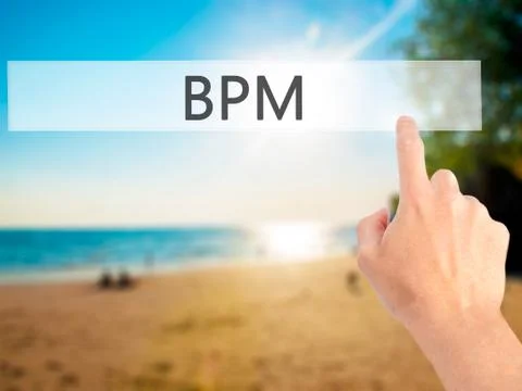 BPM (Business Process Management) - Hand pressing a button on blurred backgro 库存照片