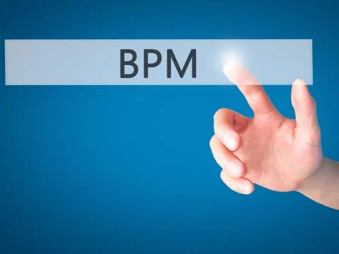BPM (Business Process Management) - Hand pressing a button on blurred backgro Stock Photos