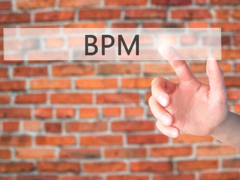 BPM (Business Process Management) - Hand pressing a button on blurred backgro Stock Photos