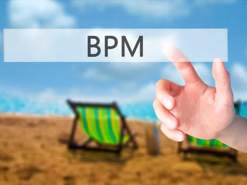 BPM (Business Process Management) - Hand pressing a button on blurred backgro Stock Photos