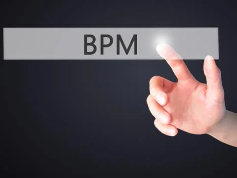BPM (Business Process Management) - Hand pressing a button on blurred backgro Stock Photos
