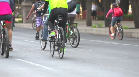BPMX97-Mexico, low angled cam on tripod pans follow hundreds of bikes. No faces. Vídeos de archivo 47860400